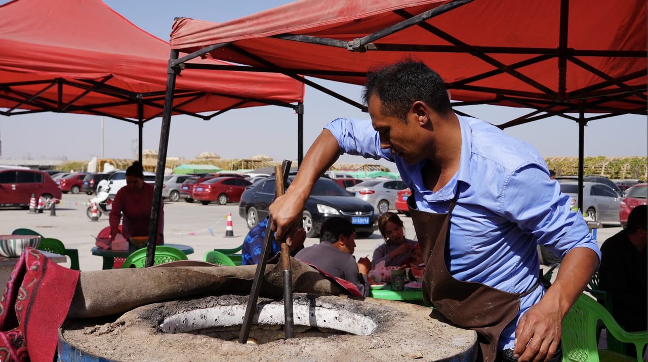 Traditional Xinjiang naan baked in the sand